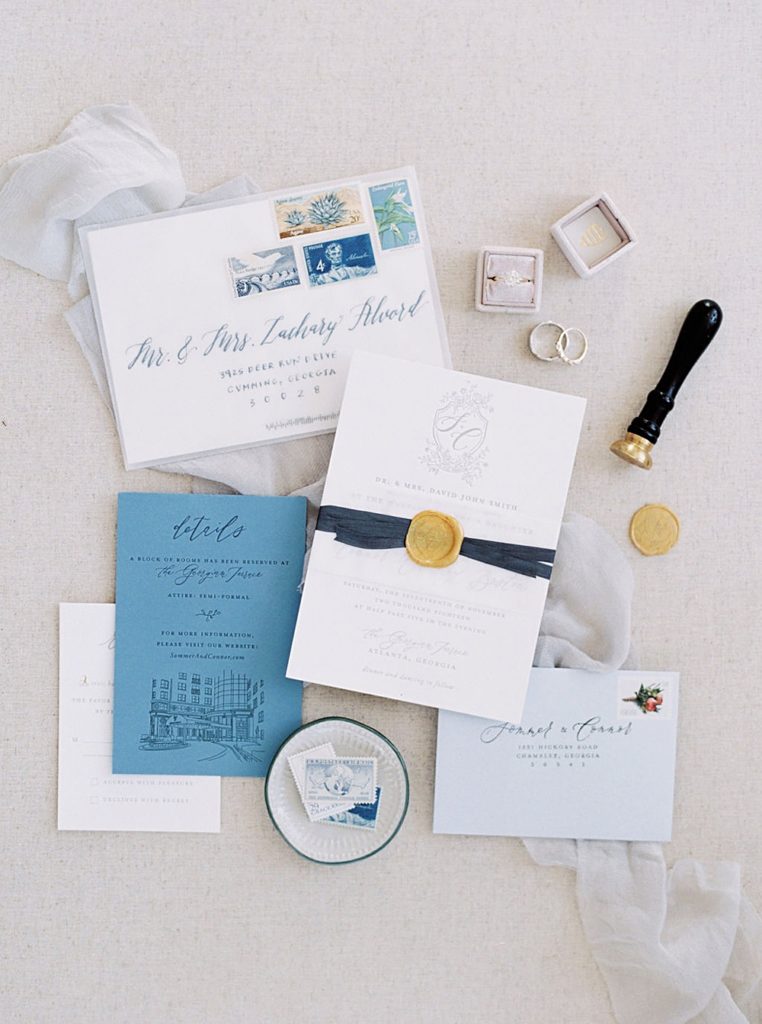 styled flat lay with personalized wedding crest and venue illustration | Atlanta Georgia Wedding at The Georgian Terrace | Shauna Veasey Photography