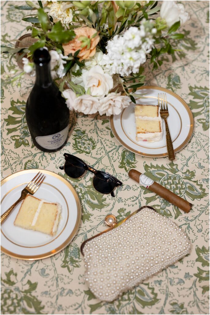 Ivory wedding cake with sugar blossoms at Crane Cottage wedding reception.