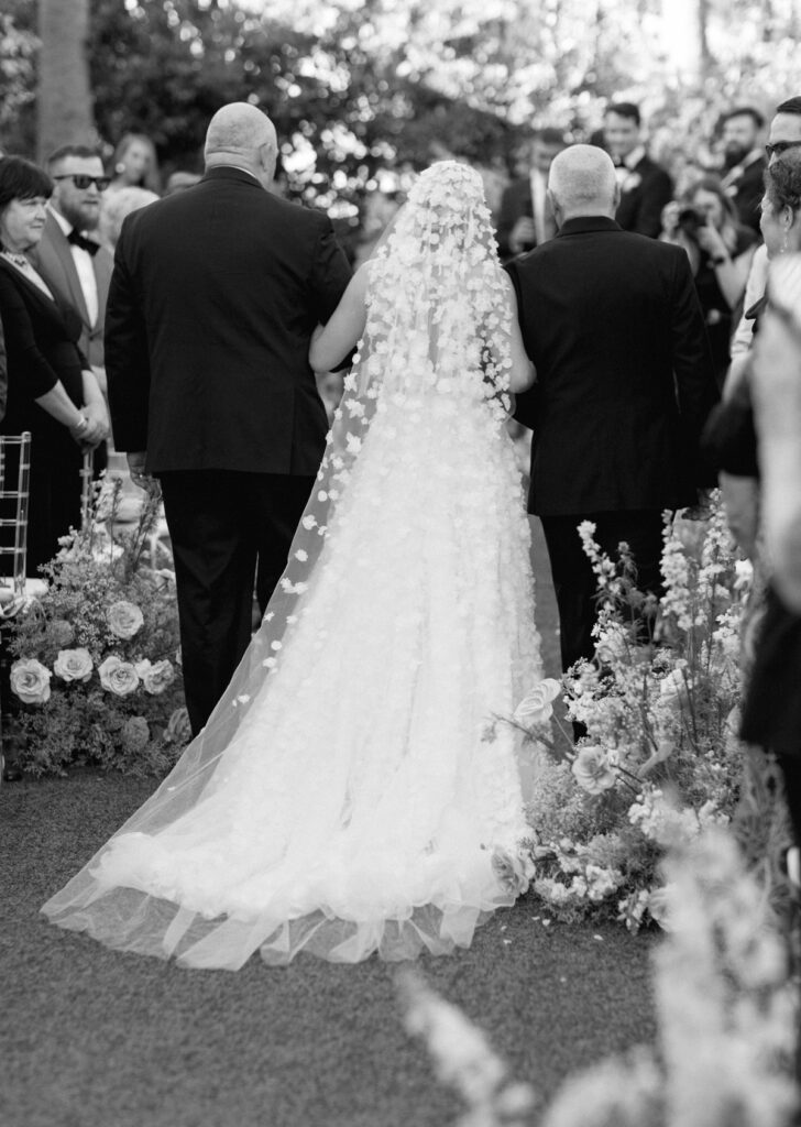 bride walking down the aisle at The Colony Hotel